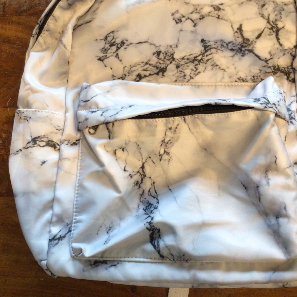 Marble Backpack with zip pocket and side water pouches